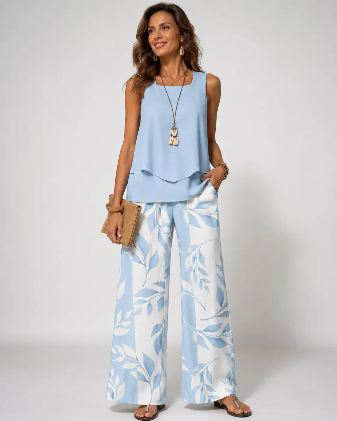 Light blue sleeveless two-piece set: ruffle hem top and wide-leg leaf-print pants