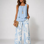 Light blue sleeveless two-piece set: ruffle hem top and wide-leg leaf-print pants
