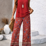 Red sleeveless layered top with floral wide-leg pants, border hem and wide cuffs