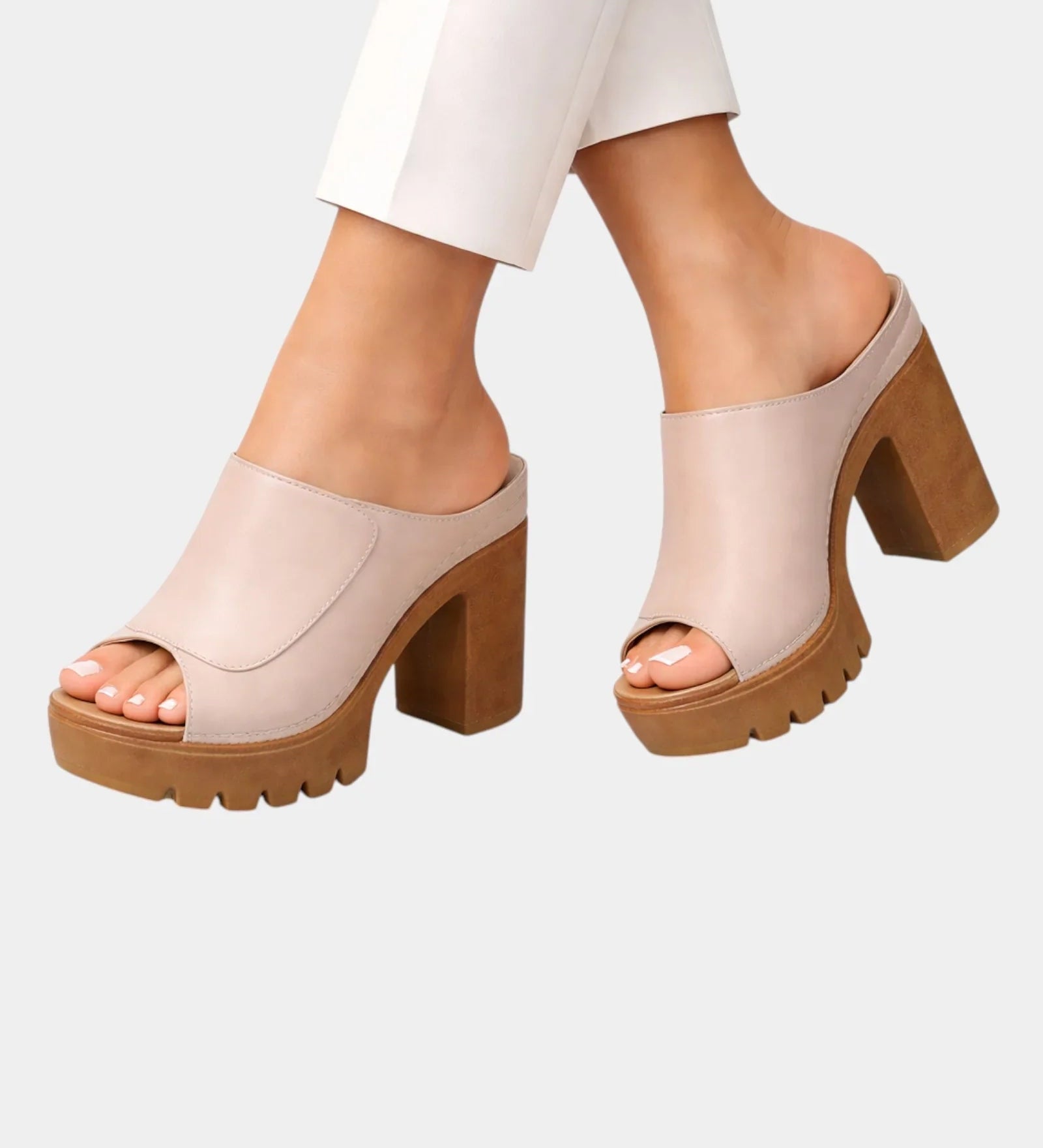 Beige platform heeled mules with open toe and chunky lug sole, slip-on design