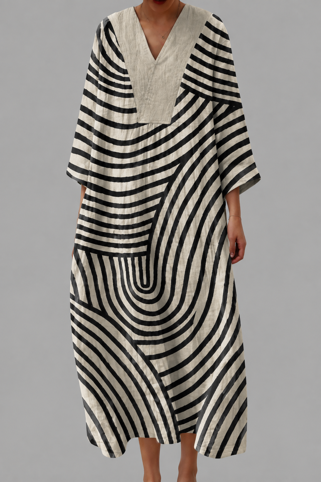 Flattering summer dress with V-neck and bold black-and-cream striped pattern, loose fit