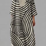 Flattering summer dress with V-neck and bold black-and-cream striped pattern, loose fit