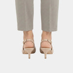 Back view of beige slingback high heels with pointed toe and ankle strap
