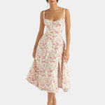 Floral pink midi dress with spaghetti straps, fitted bodice, and flared skirt