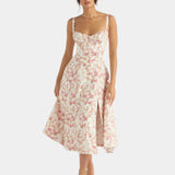 Floral pink midi dress with spaghetti straps, fitted bodice, and flared skirt