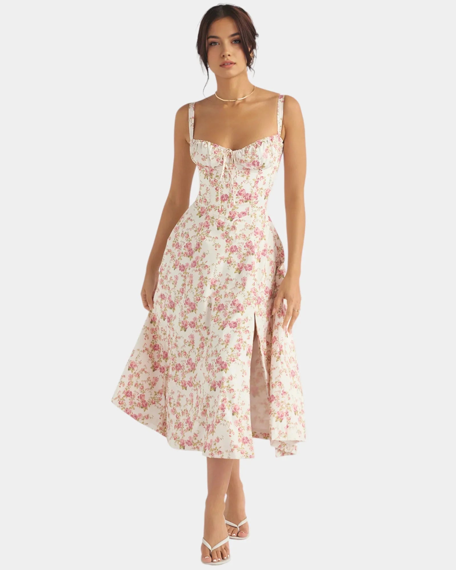 Floral pink midi dress with spaghetti straps, fitted bodice, and flared skirt