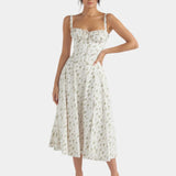 Cream floral midi dress with square neckline, thin straps, fitted bodice, and full skirt