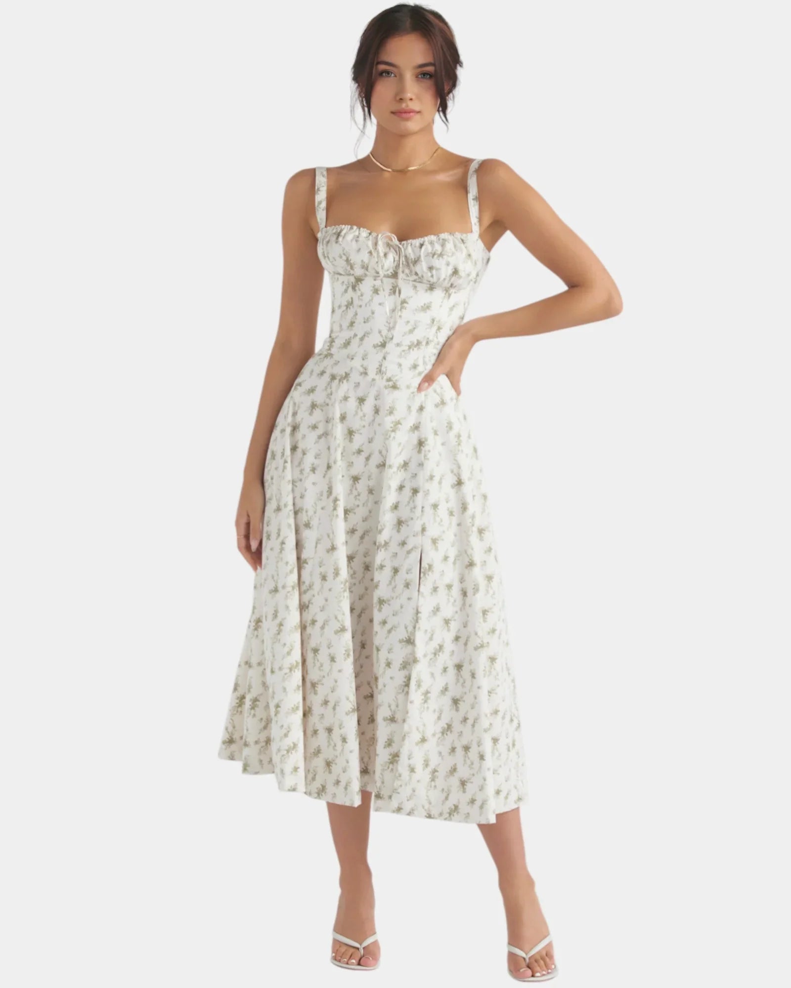 Cream floral midi dress with square neckline, thin straps, fitted bodice, and full skirt