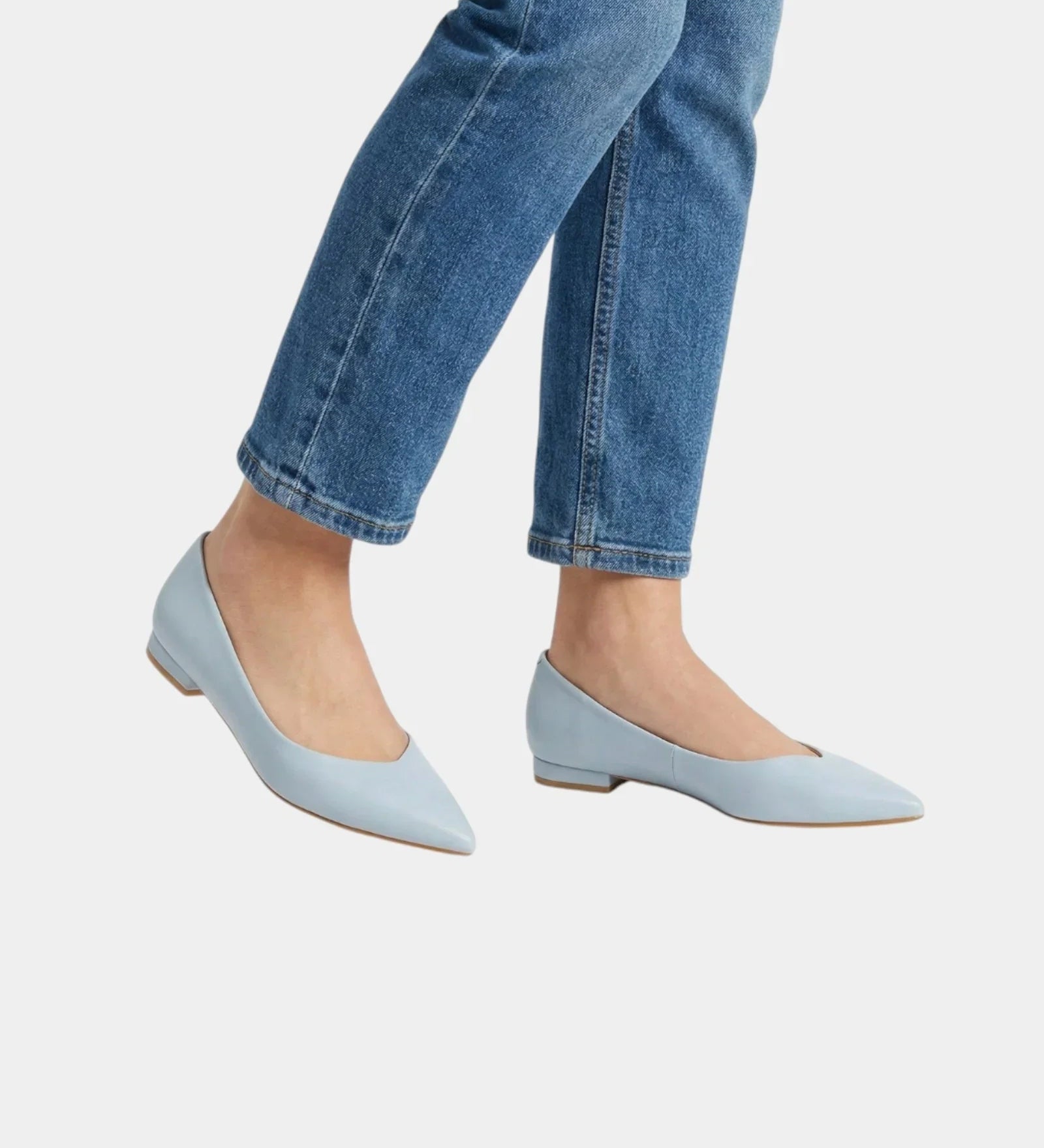 Light blue pointed-toe low-heel flats with a smooth slip-on upper and slim sole.