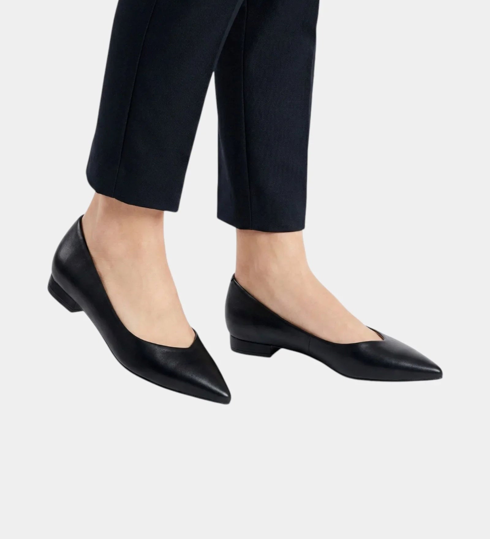 Black pointed-toe low-heel flats with a smooth upper and side profile view.