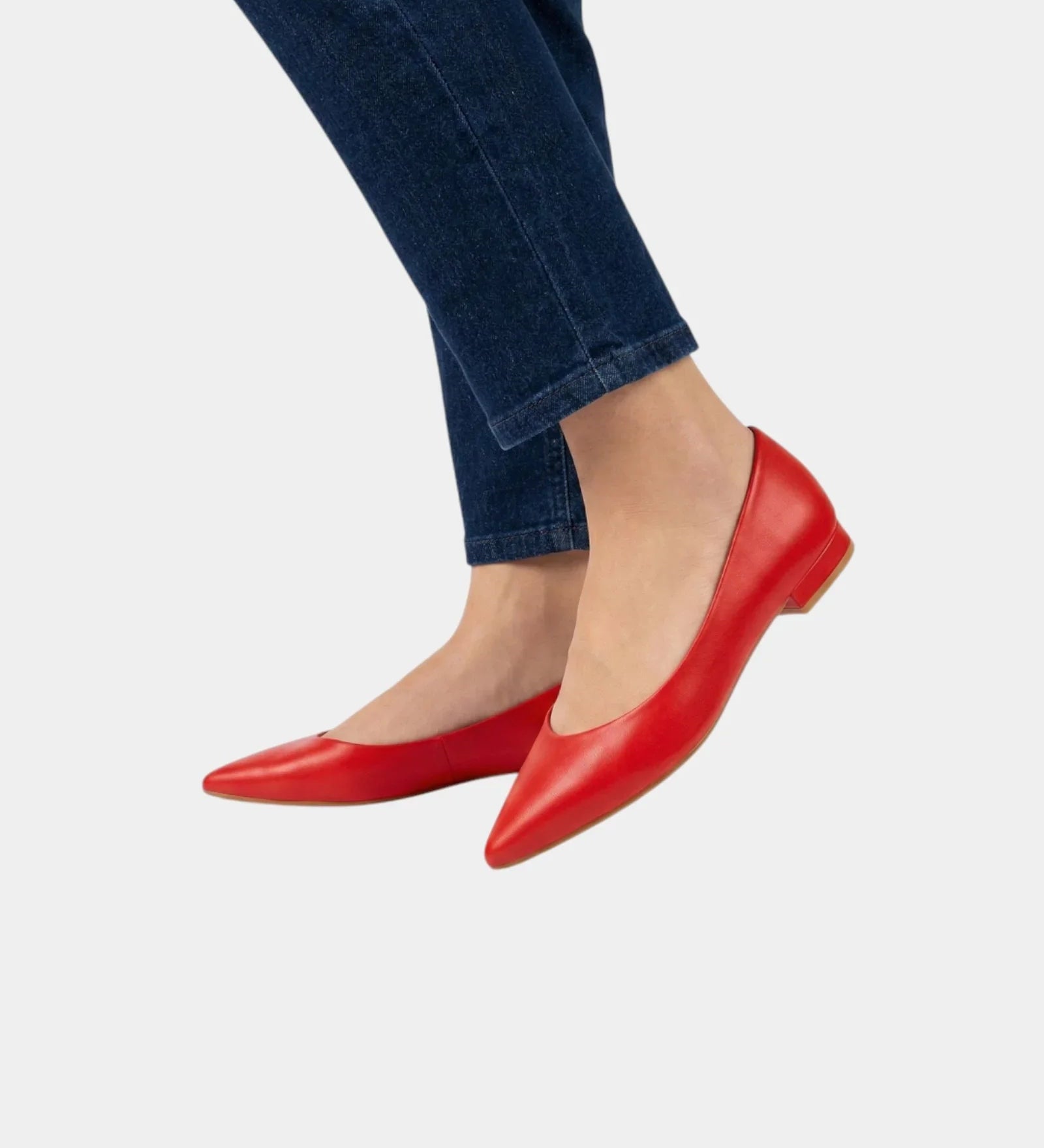 Red pointed-toe low-heel flats shown from an angled side view with slim profile.