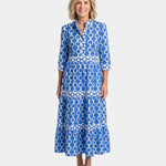 Blue midi shirt dress with three-quarter sleeves, link pattern, button-front and tiered skirt