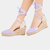 Lilac high-heel espadrille wedges with ankle tie straps and canvas peep-toe