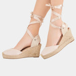 Beige high-heel espadrille wedge sandals with lace-up ankle straps