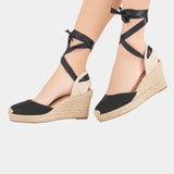 Black high-heel espadrille wedge sandals with ribbon ankle tie straps
