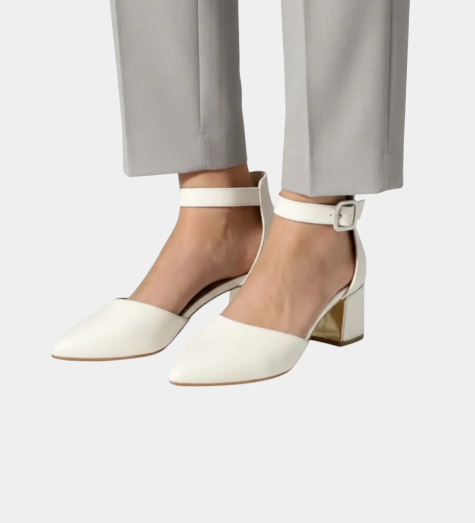 White high heels with ankle buckle strap and pointed toe block heel.