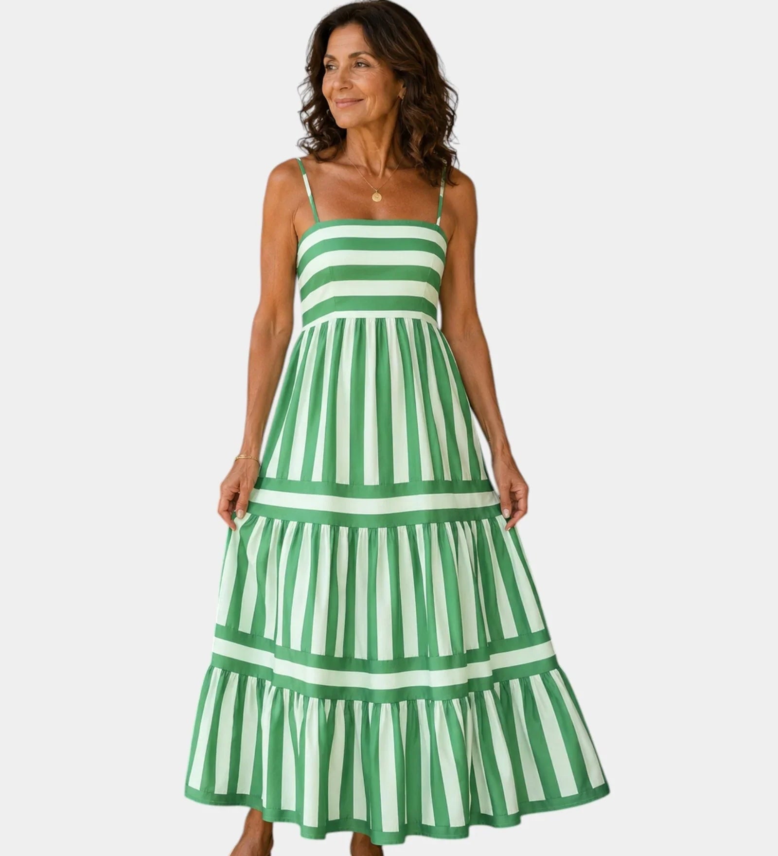 Green striped strappy tiered maxi dress with thin spaghetti straps and layered skirt.