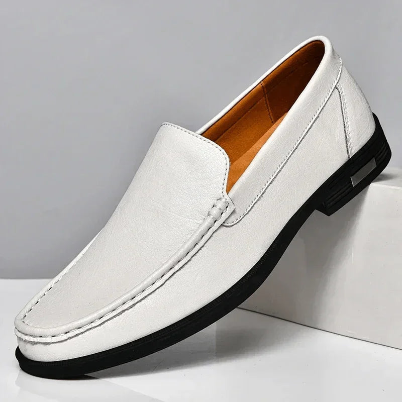 Men's white leather slip-on loafers with metal buckle and dark rubber sole