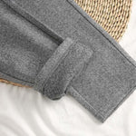 Gray herringbone trousers with cuffed hem and button placket