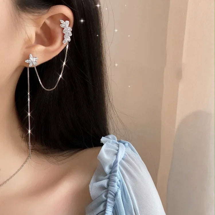 Silver flower ear cuff with dangling chain and small crystal petals
