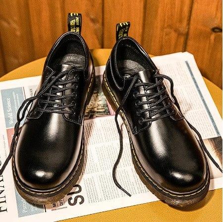 Black leather lace-up shoes with tan sole and yellow-lined collar