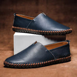 Navy leather slip-on espadrilles set with jute midsole and orange stitched edge