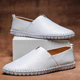 White leather slip-on espadrilles set with jute midsole and stitched edge trim