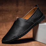 Black leather slip-on espadrilles with jute sole and dark stitched edge trim
