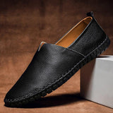 Black leather slip-on espadrilles with jute sole and dark stitched edge trim