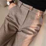Brown herringbone dress trousers with belt loops and buttoned fly