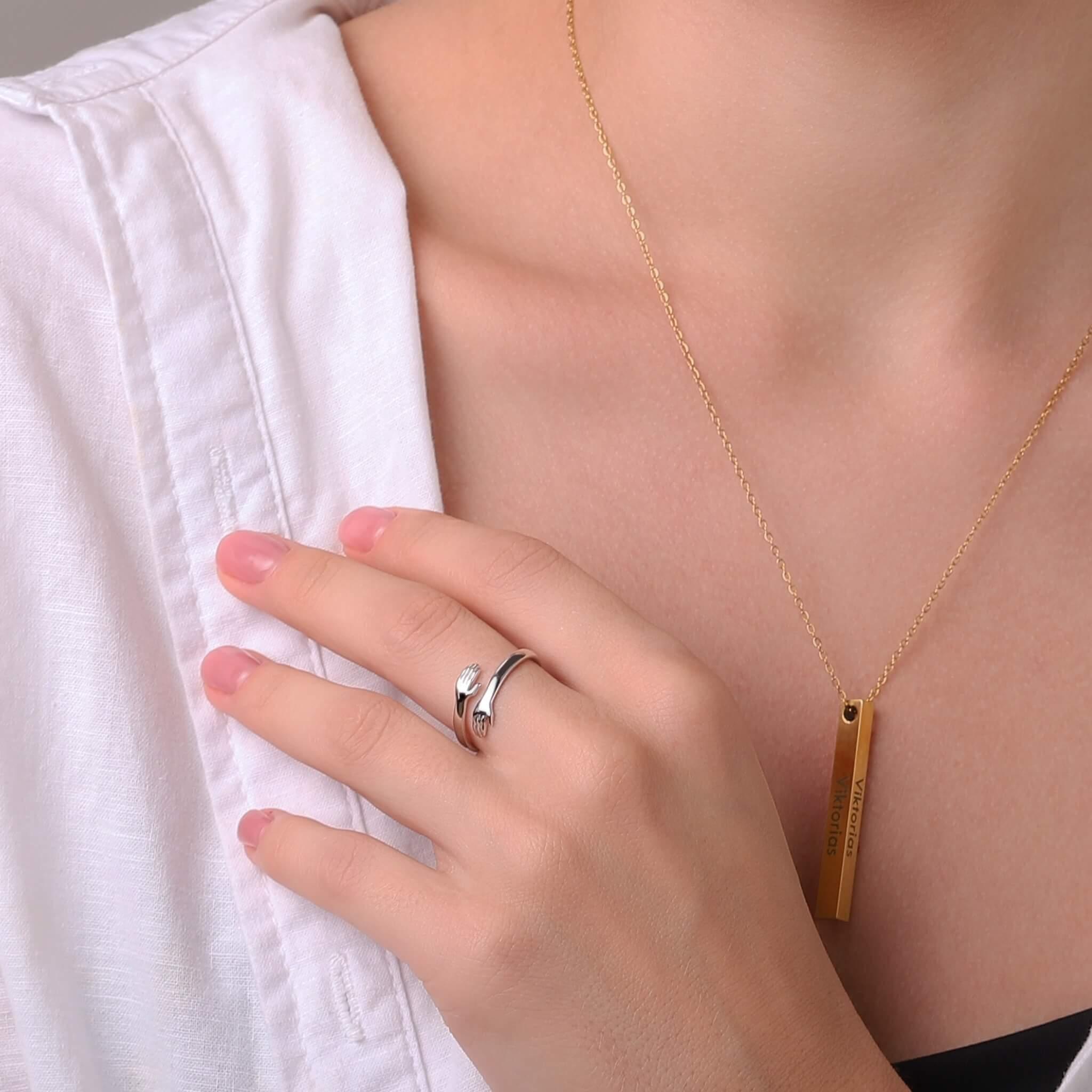 Silver-to-gold layered look ring with wave edges on finger