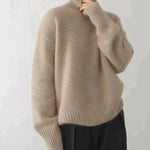 Beige cashmere turtleneck sweater with ribbed cuffs and hem, long sleeves.