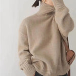 Beige turtleneck knit sweater with ribbed cuffs and hem, long sleeves, relaxed fit.