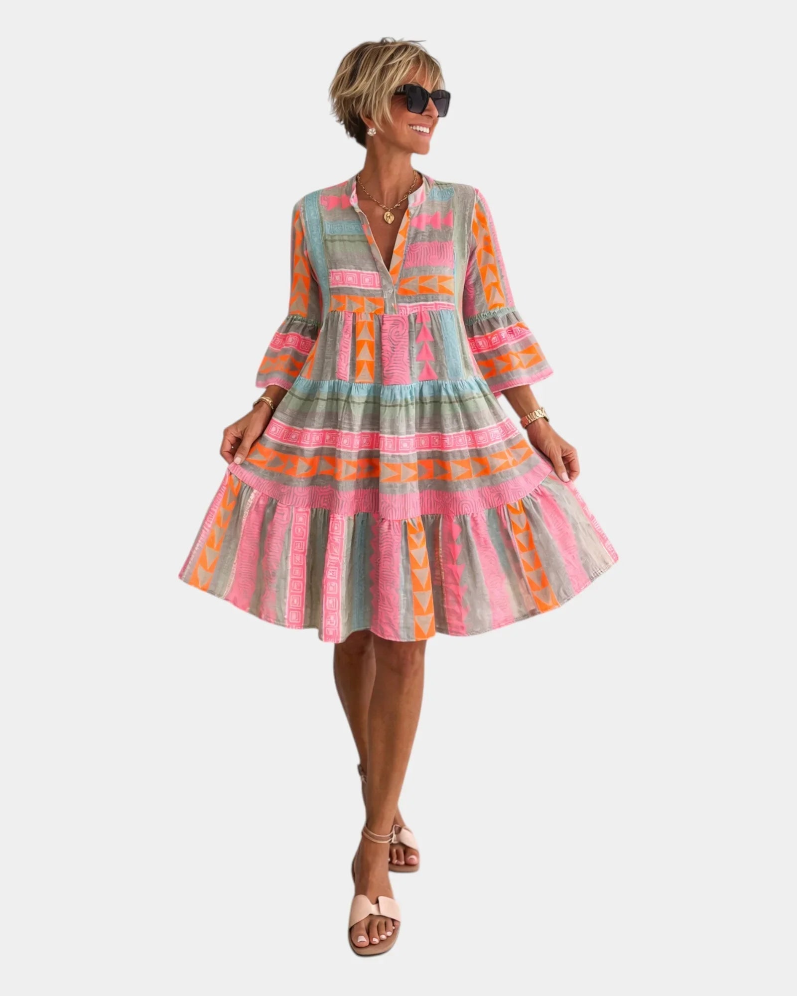 Printed midi dress with V-neck, tiered skirt, and bell sleeves in pink, orange, and greenish