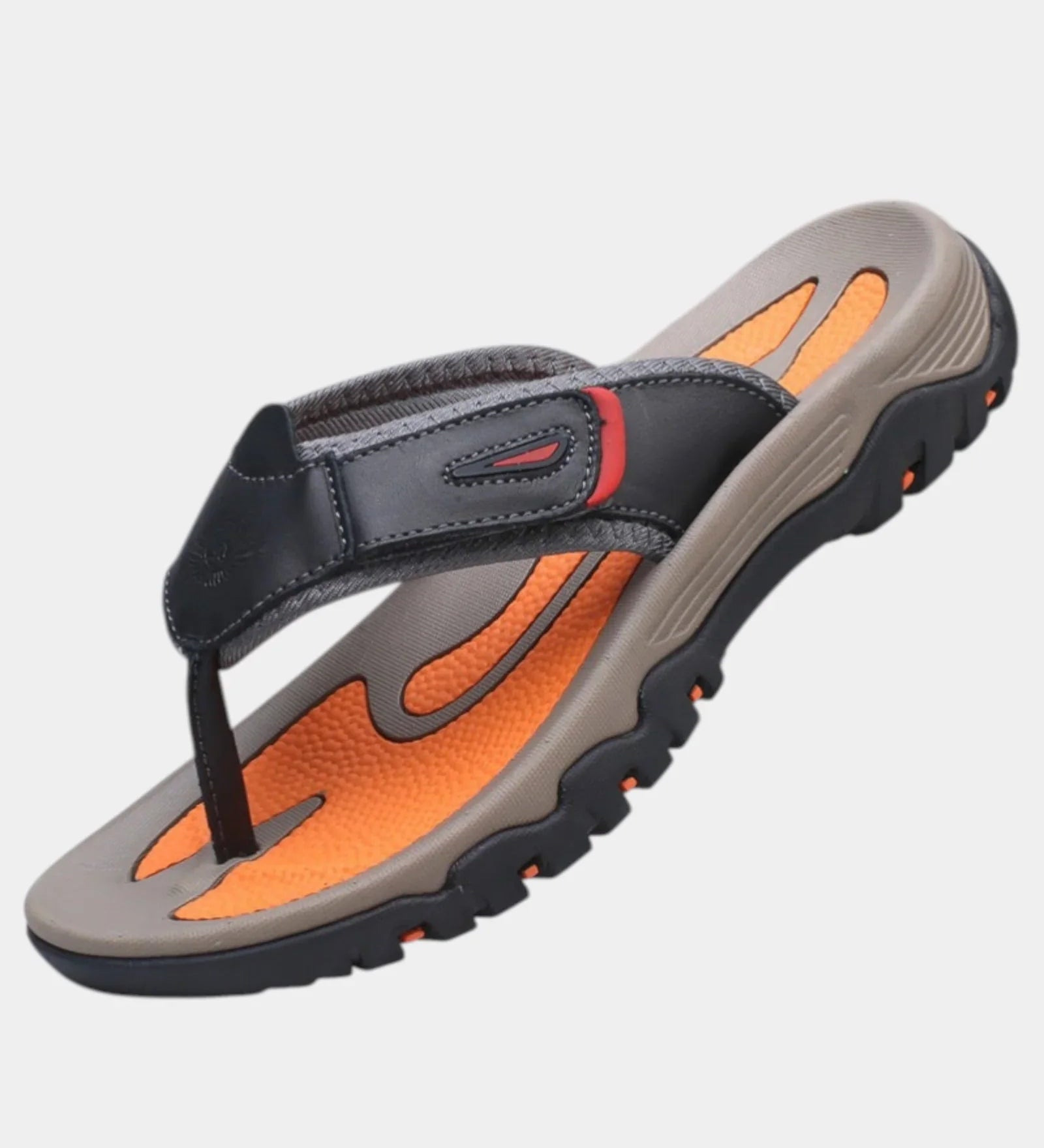 Black leather slide sandals with orange footbed and chunky gray rubber sole