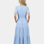 Light blue tiered maxi dress, V-neck back view, short sleeves and gathered waist