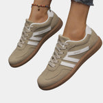 Khaki orthopedic sneakers with white side stripes and tan gum sole