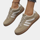 Khaki orthopedic sneakers with white side stripes and tan gum sole