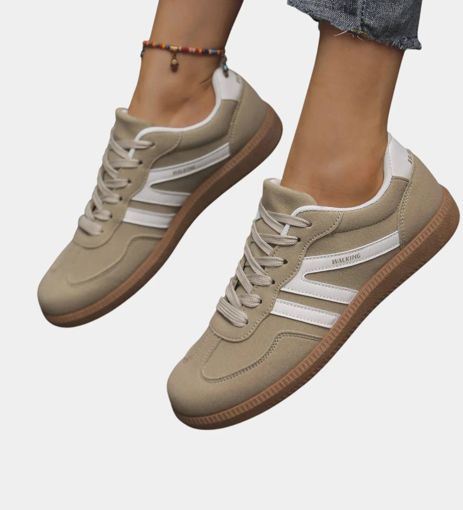 Khaki orthopedic sneakers with white side stripes and tan gum sole