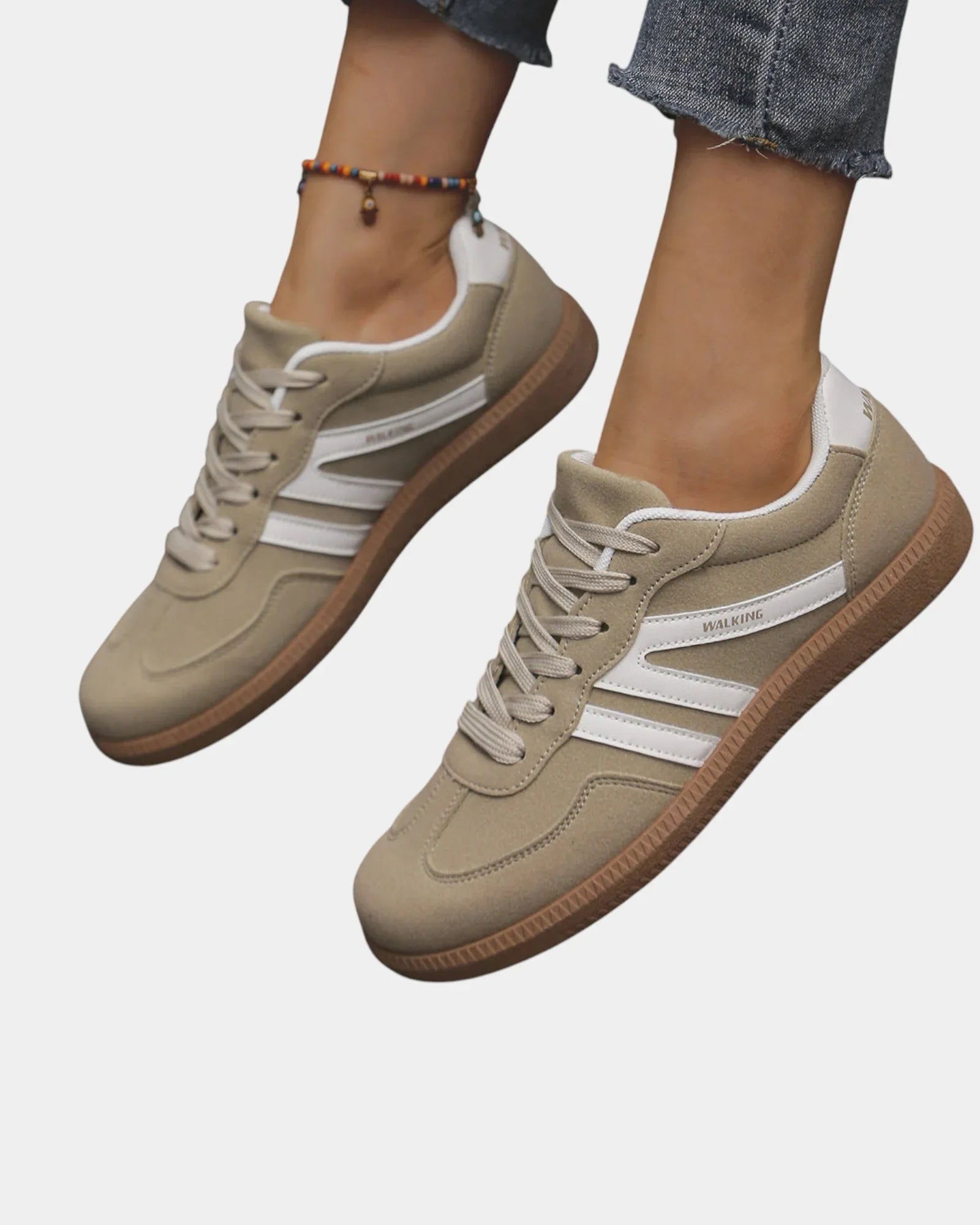 Khaki orthopedic sneakers with white side stripes and tan gum sole