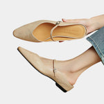 Beige flats sandals with ankle strap and square buckle detail, pointed toe