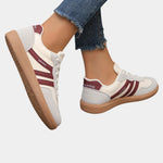 White orthopedic sneakers with burgundy side stripes and tan gum sole