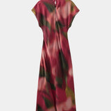 Maxi dress with short sleeves and red, burgundy, and olive abstract leaf print