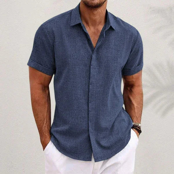 Navy blue short-sleeve button-up summer shirt with pointed collar and center front buttons.