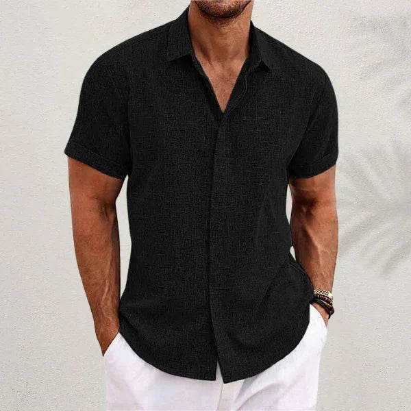 Black short-sleeve button-up summer shirt with pointed collar and front button placket.