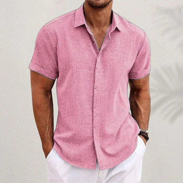 Pink short-sleeve button-up summer shirt with pointed collar and center front buttons.