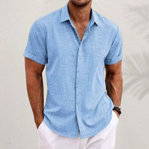 Light blue short-sleeve button-up summer shirt with pointed collar and front button placket.