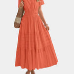Coral orange tiered maxi dress with V-neck, short sleeves, and gathered waist