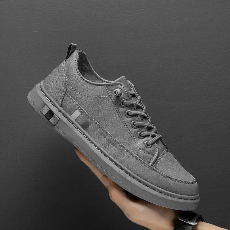Gray lace-up orthopedic shoes with side stripe and thick sole
