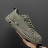 Olive green lace-up orthopedic shoes with side stripe and thick sole